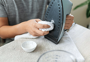 Use baking soda and water to clean an iron’s soleplate